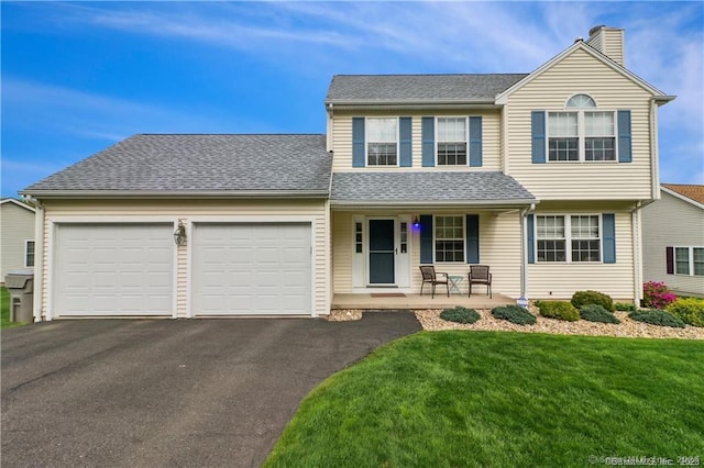126 Sunnydale Ave, Bristol, CT 06010 - traditional home featuring covered porch, a garage, driveway, a chimney, and a front yard