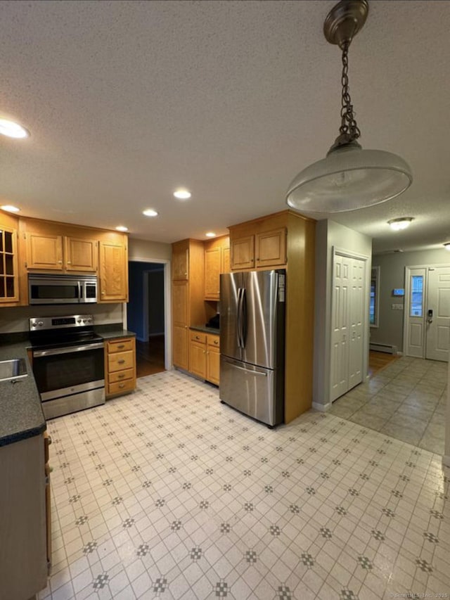 126 Sunnydale Ave, Bristol, CT 06010 - kitchen featuring appliances with stainless steel finishes, dark countertops, recessed lighting, brown cabinets, and glass insert cabinets