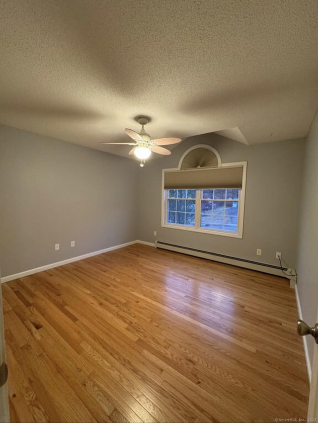 126 Sunnydale Ave, Bristol, CT 06010 - unfurnished room with a baseboard heating unit, wood finished floors, a textured ceiling, and ceiling fan