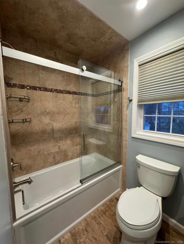 126 Sunnydale Ave, Bristol, CT 06010 - bathroom featuring wood finished floors and bath / shower combo with glass door