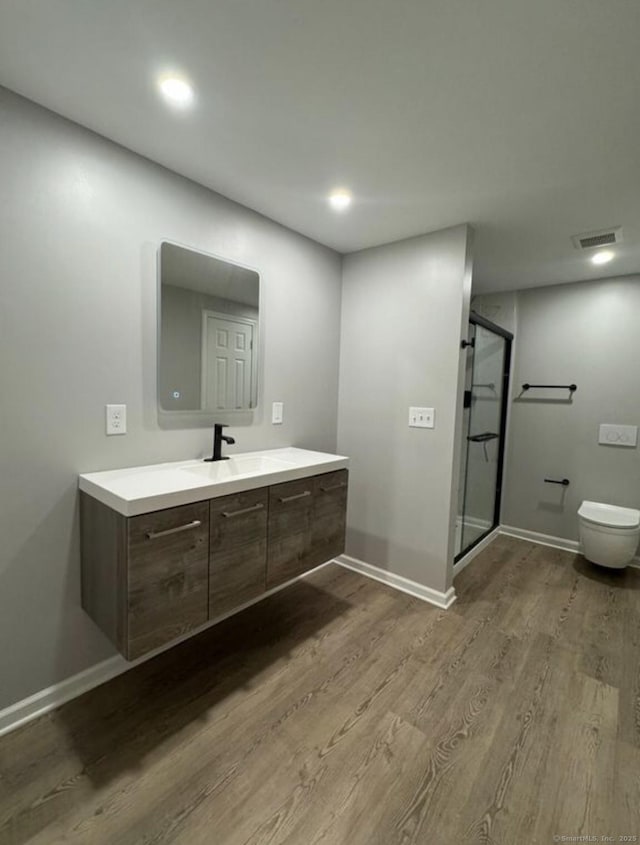 126 Sunnydale Ave, Bristol, CT 06010 - full bath featuring wood finished floors, vanity, a stall shower, and recessed lighting