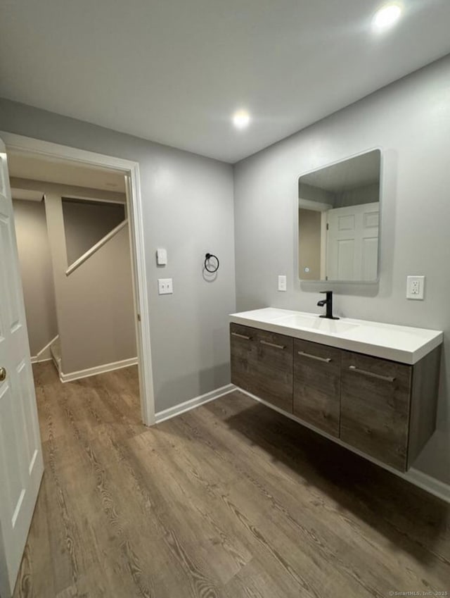 126 Sunnydale Ave, Bristol, CT 06010 - bathroom featuring wood finished floors, vanity, and recessed lighting