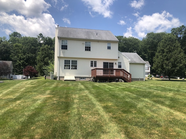 126 Sunnydale Ave, Bristol, CT 06010 - rear view of house with a deck, a chimney, and a yard