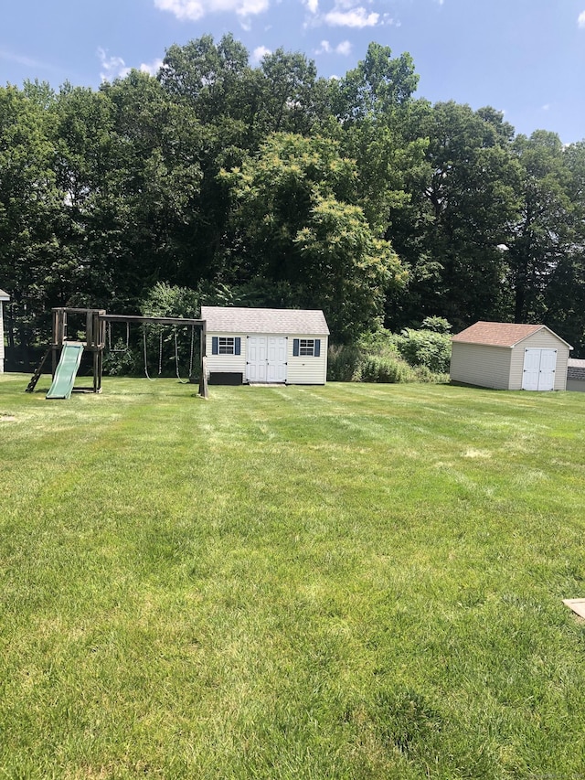 126 Sunnydale Ave, Bristol, CT 06010 - view of grassy yard featuring a shed and a playground