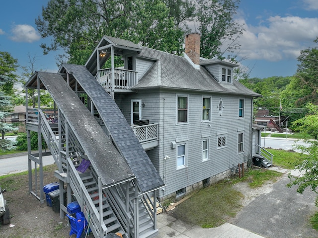 908 Main St, Torrington, CT 06790 - rear view of property with roof with shingles, stairway, a chimney, and a balcony
