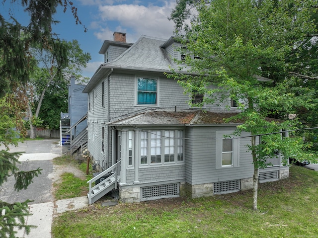 908 Main St, Torrington, CT 06790 - back of house featuring a chimney, stairs, a shingled roof, and driveway