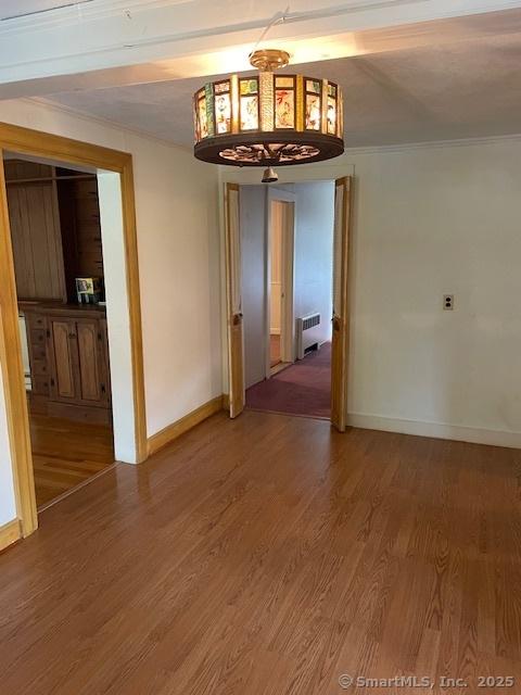 574 Cutlers Farm Rd, Monroe, CT 06468 - unfurnished room featuring radiator heating unit and light wood-type flooring