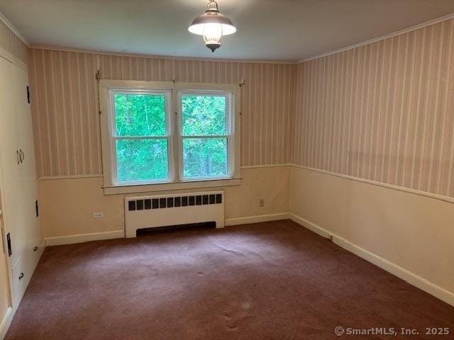 574 Cutlers Farm Rd, Monroe, CT 06468 - spare room with radiator heating unit, carpet flooring, and ornamental molding