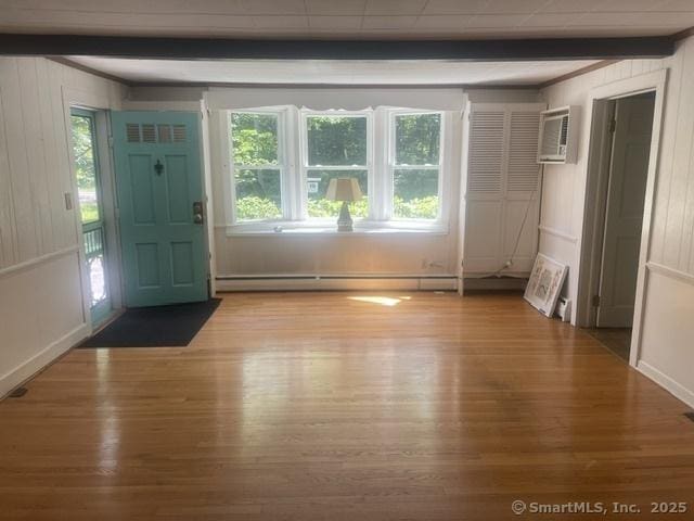 574 Cutlers Farm Rd, Monroe, CT 06468 - entrance foyer featuring baseboard heating, beamed ceiling, wood finished floors, and plenty of natural light