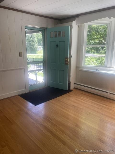574 Cutlers Farm Rd, Monroe, CT 06468 - entryway featuring baseboard heating, light wood finished floors, and ornamental molding