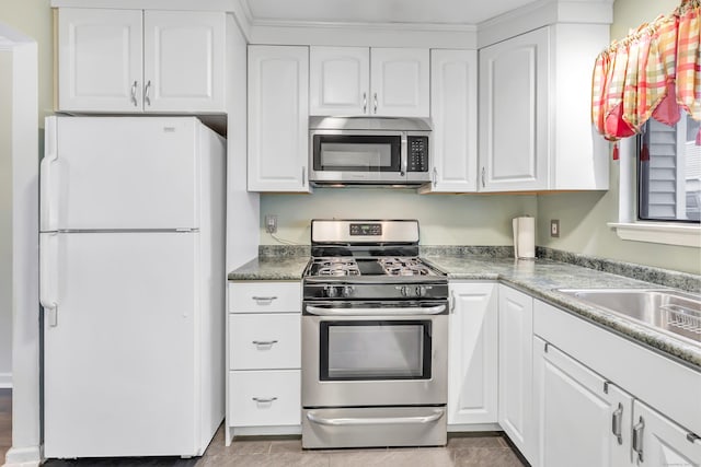 233 Derby Ave Unit 103, Derby, CT 06418 - kitchen featuring stainless steel appliances, white cabinetry, and light countertops