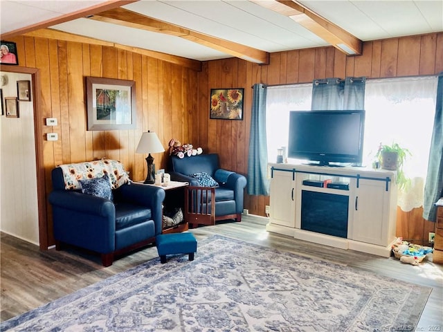 44 Cheyenne Rd, East Hartford, CT 06118 - living area with beam ceiling, wood finished floors, and wooden walls