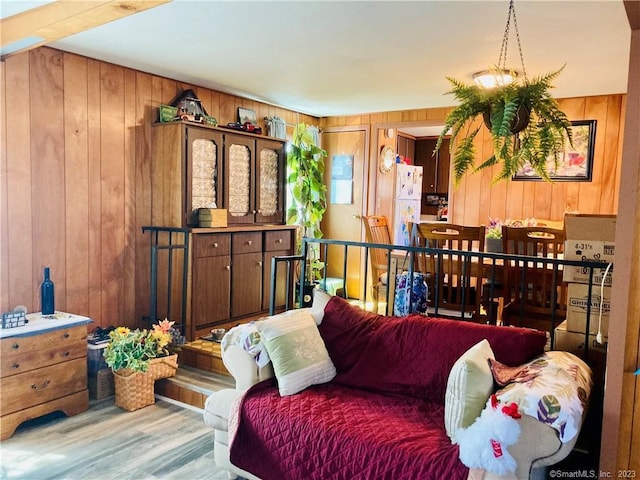 44 Cheyenne Rd, East Hartford, CT 06118 - living area featuring wood walls and wood finished floors