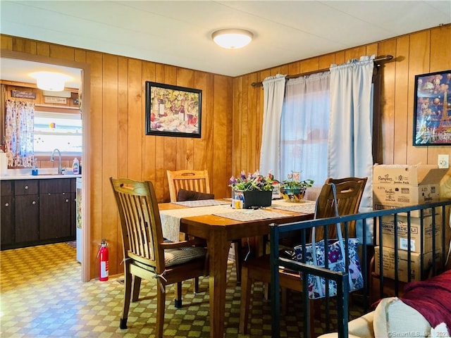 44 Cheyenne Rd, East Hartford, CT 06118 - dining room featuring light floors and wood walls
