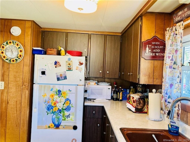 44 Cheyenne Rd, East Hartford, CT 06118 - kitchen featuring white appliances, light countertops, and wood walls