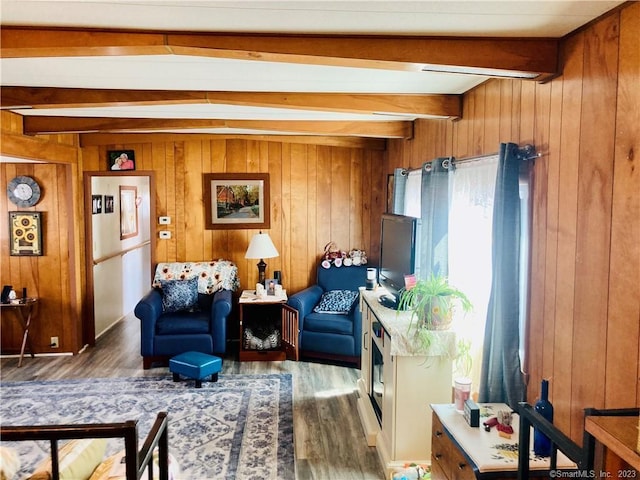 44 Cheyenne Rd, East Hartford, CT 06118 - living area featuring beamed ceiling, wood finished floors, and wood walls