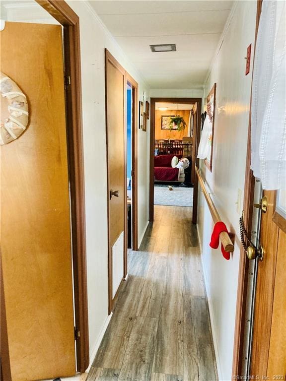 44 Cheyenne Rd, East Hartford, CT 06118 - hallway featuring wood finished floors and ornamental molding