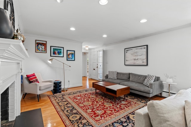 1981 Asylum Ave, West Hartford, CT 06117 - living area featuring crown molding, a brick fireplace, light wood-type flooring, recessed lighting, and baseboard heating