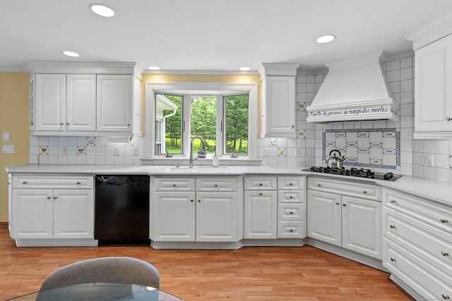 1981 Asylum Ave, West Hartford, CT 06117 - kitchen featuring black appliances, premium range hood, crown molding, light countertops, and recessed lighting