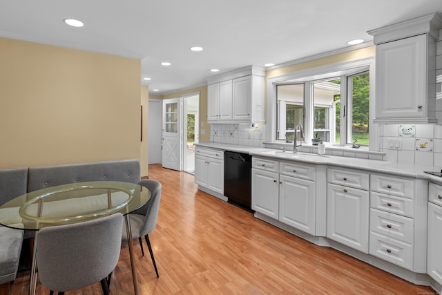 1981 Asylum Ave, West Hartford, CT 06117 - kitchen featuring dishwasher, ornamental molding, healthy amount of natural light, light wood-style flooring, and light countertops