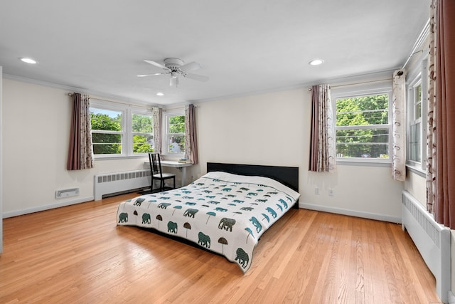1981 Asylum Ave, West Hartford, CT 06117 - bedroom with radiator, wood finished floors, multiple windows, recessed lighting, and crown molding