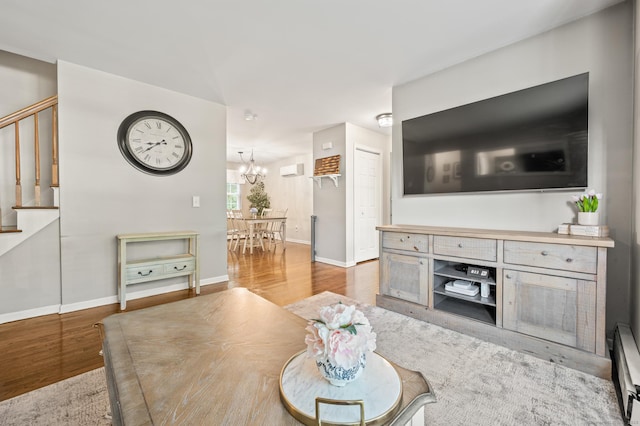22 Quail Run, Bloomfield, CT 06002 - living area with wood finished floors, a chandelier, and stairs