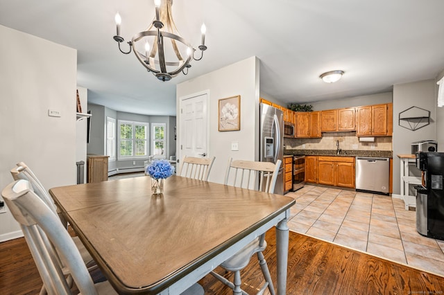 22 Quail Run, Bloomfield, CT 06002 - dining area featuring a chandelier and light wood-style flooring