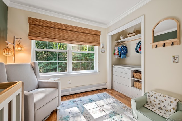 22 Quail Run, Bloomfield, CT 06002 - sitting room featuring healthy amount of natural light, crown molding, a baseboard heating unit, and wood finished floors