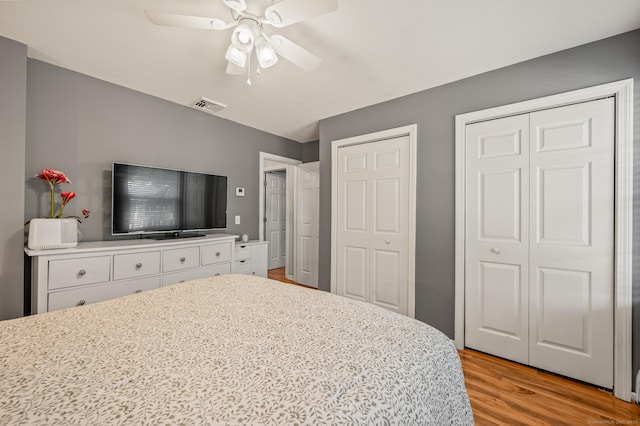 22 Quail Run, Bloomfield, CT 06002 - bedroom with multiple closets, light wood-type flooring, and ceiling fan