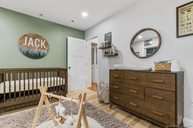57 Notch Hill Rd, North Branford, CT 06471 - bedroom with light wood finished floors and a crib