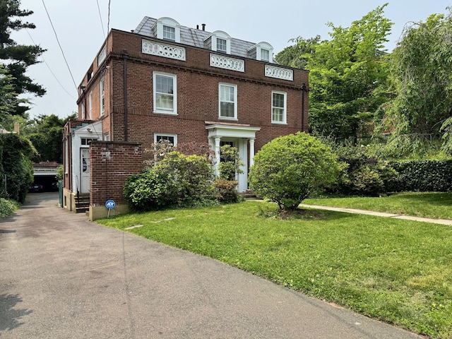 192 Bishop St, New Haven, CT 06511 - view of front facade featuring brick siding, a front lawn, and entry steps
