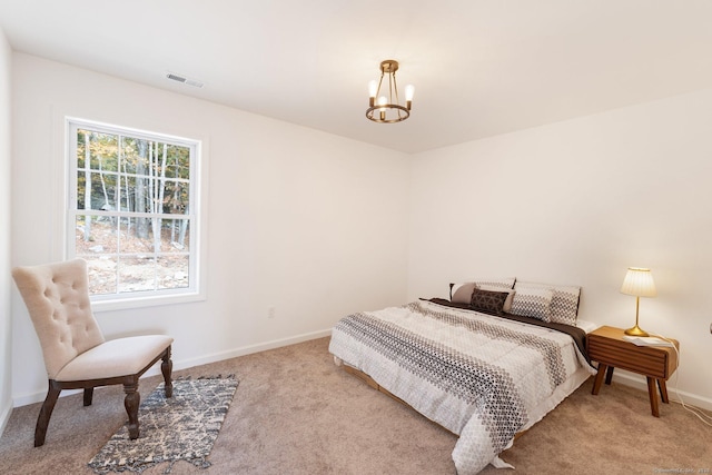 807 Pucker St, Coventry, CT 06238 - carpeted bedroom featuring a chandelier and baseboards