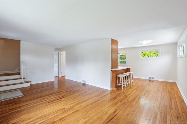 10 John Smith Dr, West Hartford, CT 06107 - empty room with light wood finished floors, healthy amount of natural light, and stairs