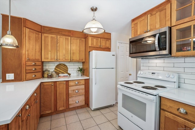 10 John Smith Dr, West Hartford, CT 06107 - kitchen featuring white appliances and brown cabinetry