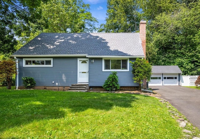 10 John Smith Dr, West Hartford, CT 06107 - view of front of house featuring entry steps, a chimney, a front lawn, a detached garage, and roof with shingles