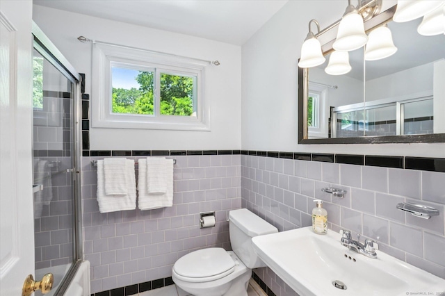 10 John Smith Dr, West Hartford, CT 06107 - full bathroom featuring tile walls, enclosed tub / shower combo, and a wainscoted wall