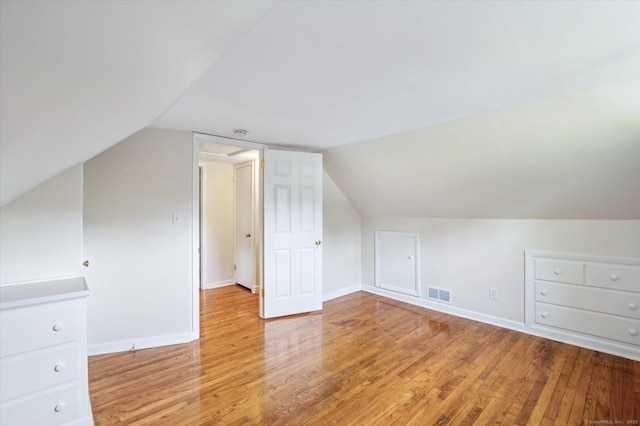 10 John Smith Dr, West Hartford, CT 06107 - additional living space with light wood-style floors and vaulted ceiling