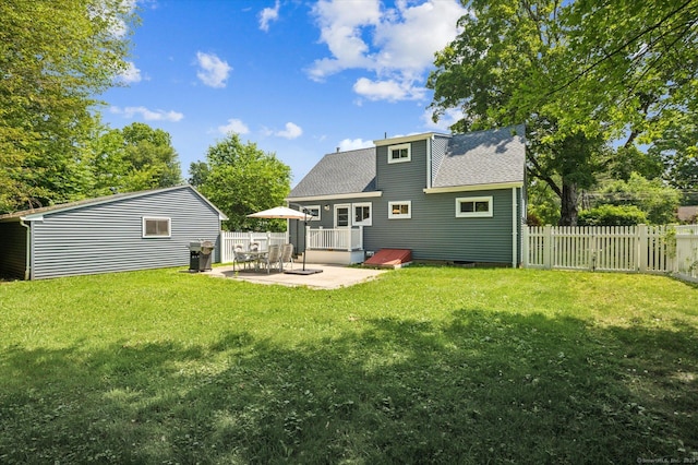 10 John Smith Dr, West Hartford, CT 06107 - rear view of property featuring a patio and roof with shingles