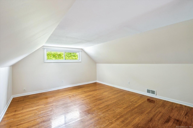 10 John Smith Dr, West Hartford, CT 06107 - bonus room with light wood finished floors and lofted ceiling