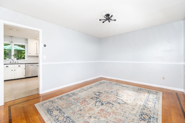 55 Charles Mary Dr, East Hampton, CT 06424 - empty room featuring light wood-style flooring and a sink