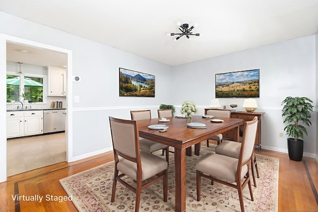 55 Charles Mary Dr, East Hampton, CT 06424 - dining room with light wood-style flooring and baseboards