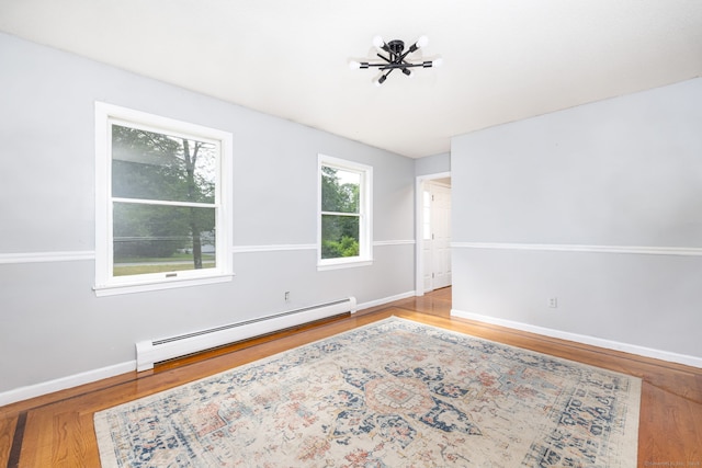 55 Charles Mary Dr, East Hampton, CT 06424 - unfurnished room featuring a baseboard heating unit and wood finished floors
