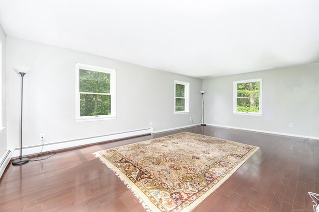 55 Charles Mary Dr, East Hampton, CT 06424 - spare room featuring wood finished floors and baseboard heating