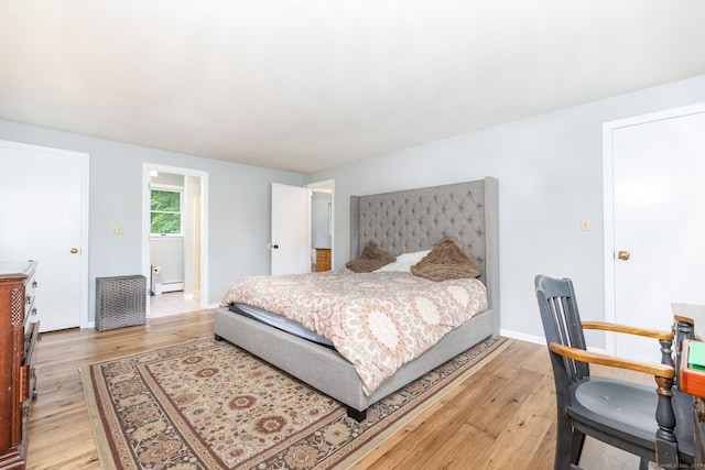 55 Charles Mary Dr, East Hampton, CT 06424 - bedroom with light wood-type flooring and a baseboard radiator
