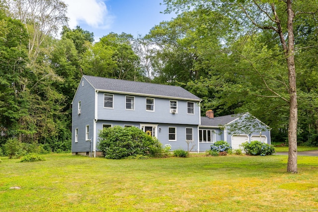 55 Charles Mary Dr, East Hampton, CT 06424 - colonial inspired home with a garage, a front yard, a chimney, asphalt driveway, and roof with shingles