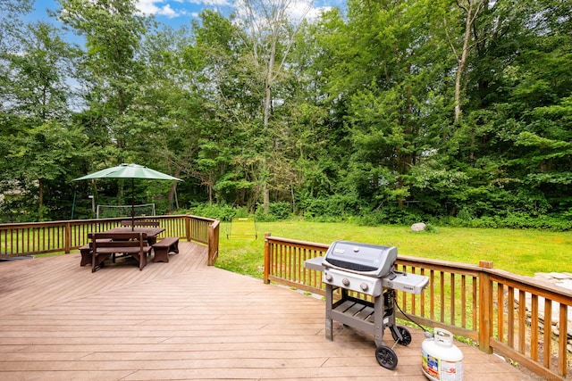 55 Charles Mary Dr, East Hampton, CT 06424 - deck with a grill, a lawn, and view of scattered trees