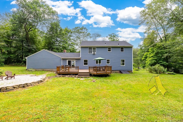 55 Charles Mary Dr, East Hampton, CT 06424 - rear view of property with a wooden deck, a fire pit, and a yard