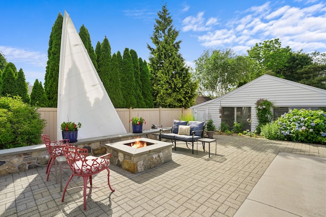 317 Victoria Lawn, Stratford, CT 06615 - fenced backyard with a patio area and an outdoor living space with a fire pit