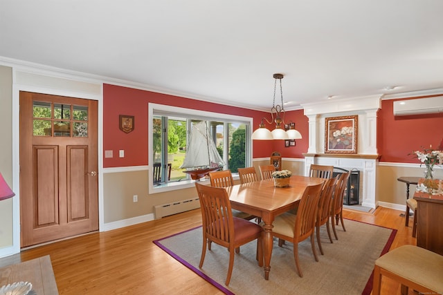 317 Victoria Lawn, Stratford, CT 06615 - dining room featuring an AC wall unit, baseboard heating, light wood-style floors, and ornamental molding