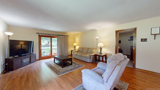 1102 Summer Hill Dr Unit 1102, South Windsor, CT 06074 - living area with wood finished floors and baseboards